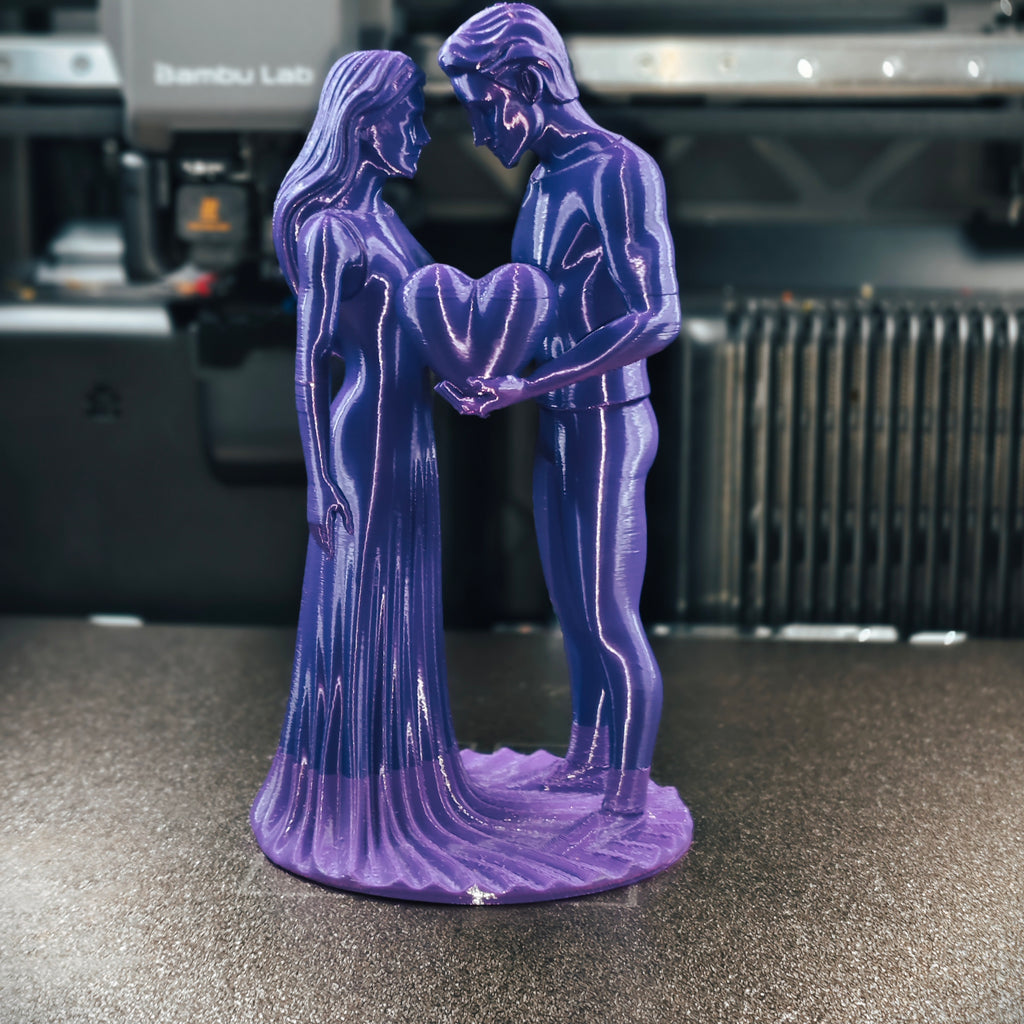 Romantic Couple with Heart Statue