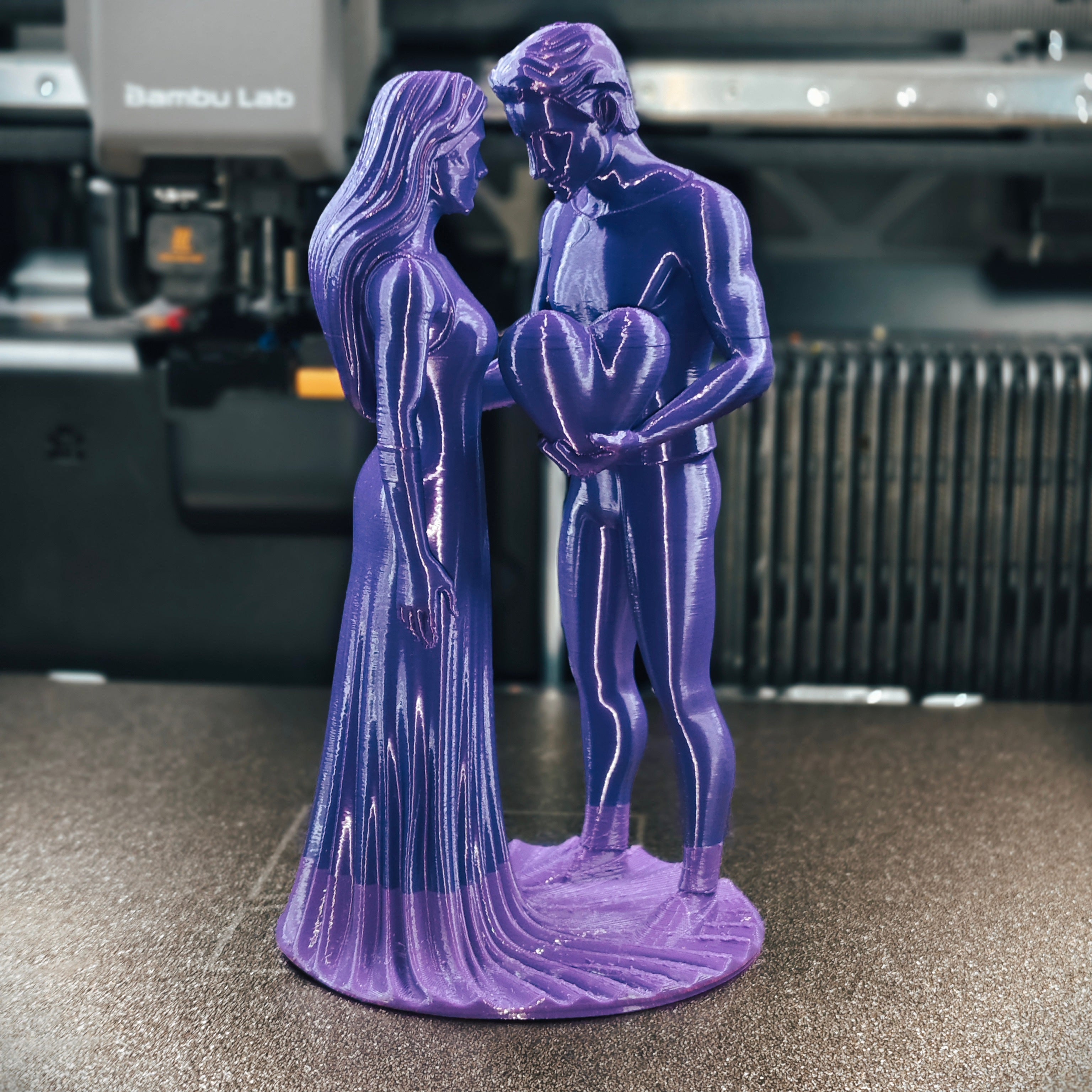 Romantic Couple with Heart Statue